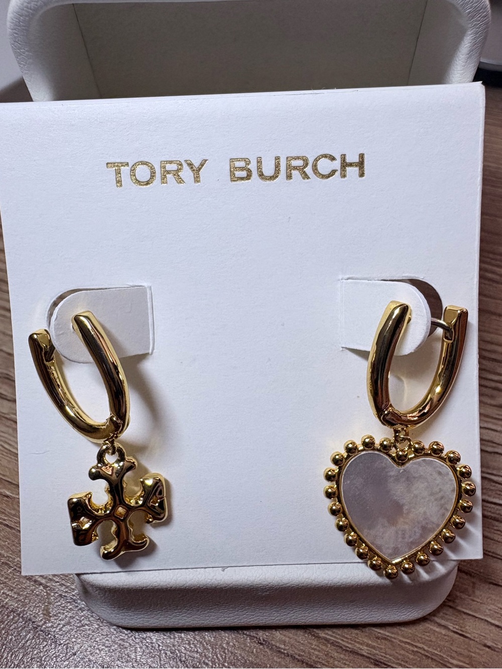 Tory Burch Gold Asymmetrical Huggie Earrings with Logo Cross & Heart